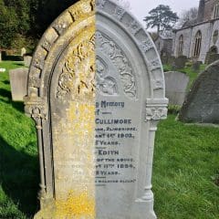 A gravestone in a cemetery is half covered with moss and weathered, while the other half is digitally restored through expert Stone Restorations. A church and other headstones are visible in the background.