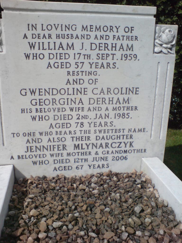 A gravestone with inscriptions for William J. Derham, who died on 17th September 1959 at 57 years, and Gwendoline Caroline Georgina Derham, who died on 2nd January 1985 at 78 years. Mention of Jennifer Mlynarczyk, died 12th June 2006 at 67 years.